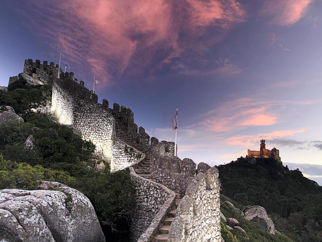 Walls of the Castle of the Moors with the Pena Palace in the background on the right