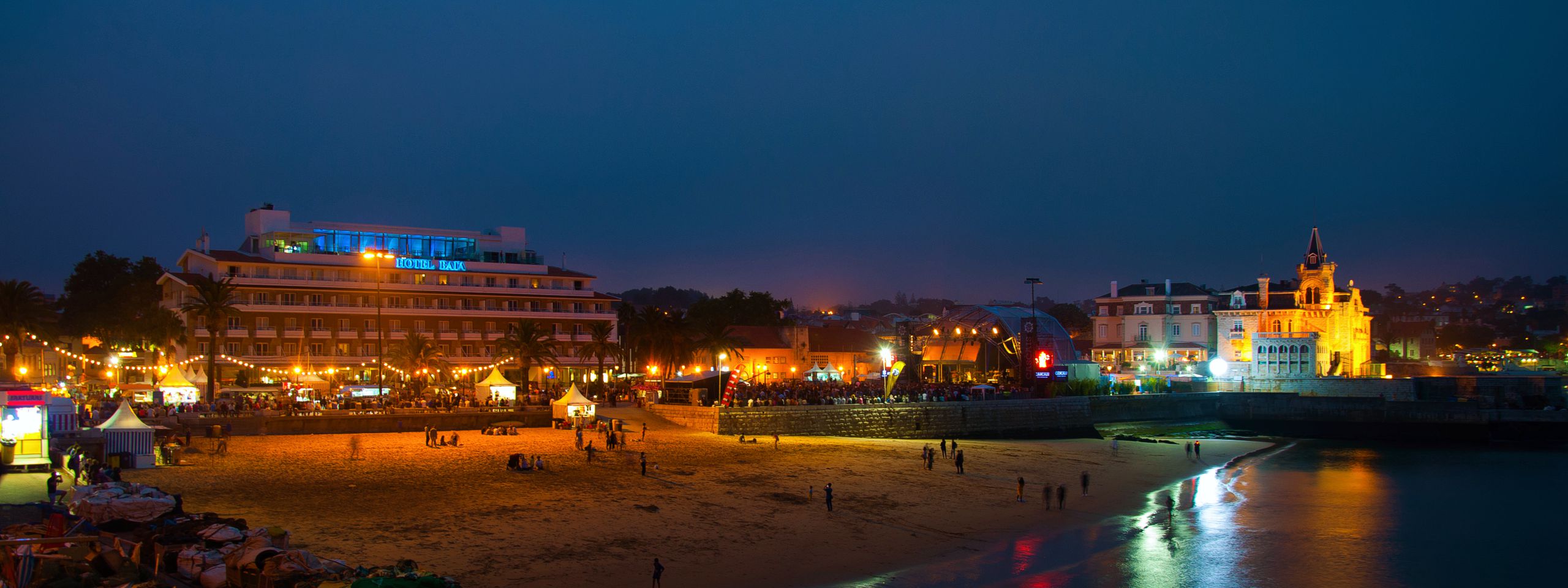 Ribeira Beach at night with the Baia Hotel on the left, Villa Cascais Guesthouse and Seixas Palace on the right, Cascais Portugal