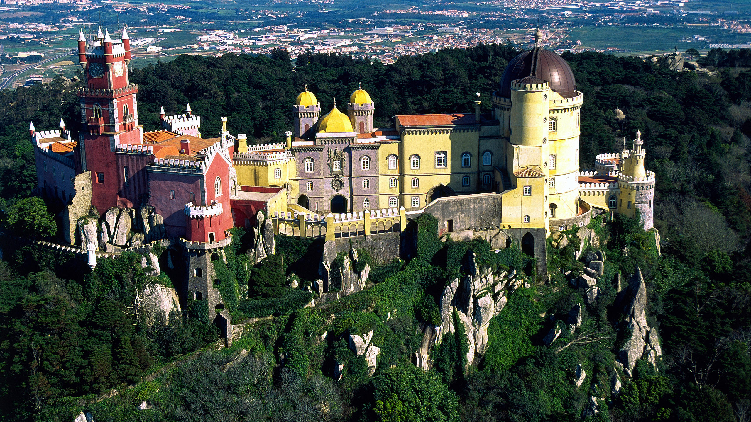Birdview of Pena National Palace overlooking Sintra's plain